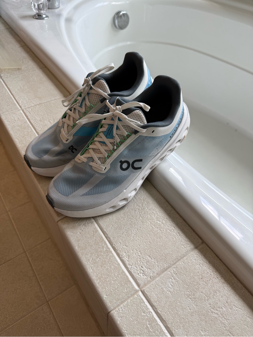 On Running Women's Cloud With White and Light Blue Accents